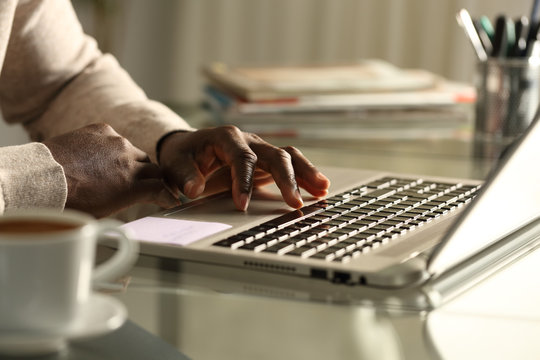 Black Man Hand Using Touchpad On Laptop At Night