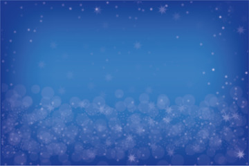 Blue Christmas background with bokeh and white stars.