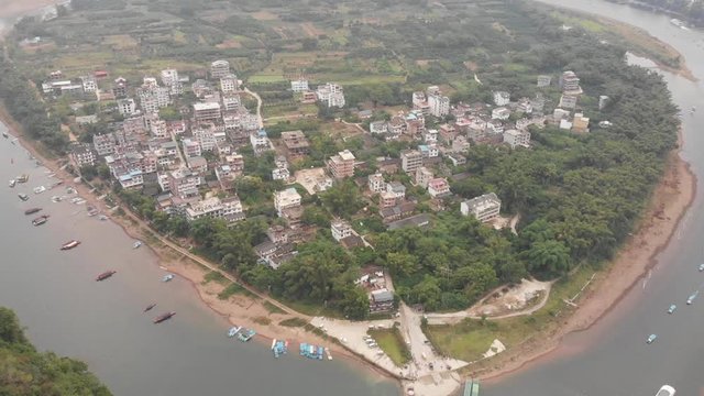 Aerial ascending above Yangshuo Lijiang River Scenic Area at Xingping Village, Guangxi, China