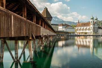 Historic city center of Lucerne with famous Chapel Bridge and Mount Pilatus summit in the...