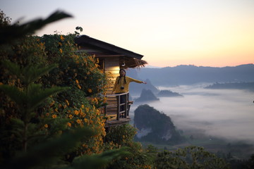 Fototapeta premium Women enjoy the view of Phu Lanka in the morning in Phayao, Thailand
