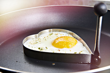 Fried eggs in heart form