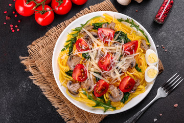 Spaghetti with mushrooms, cheese, spinach, rukkola and cherry tomatoes