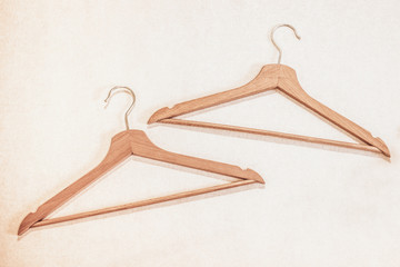 Two wooden clothes hangers close up