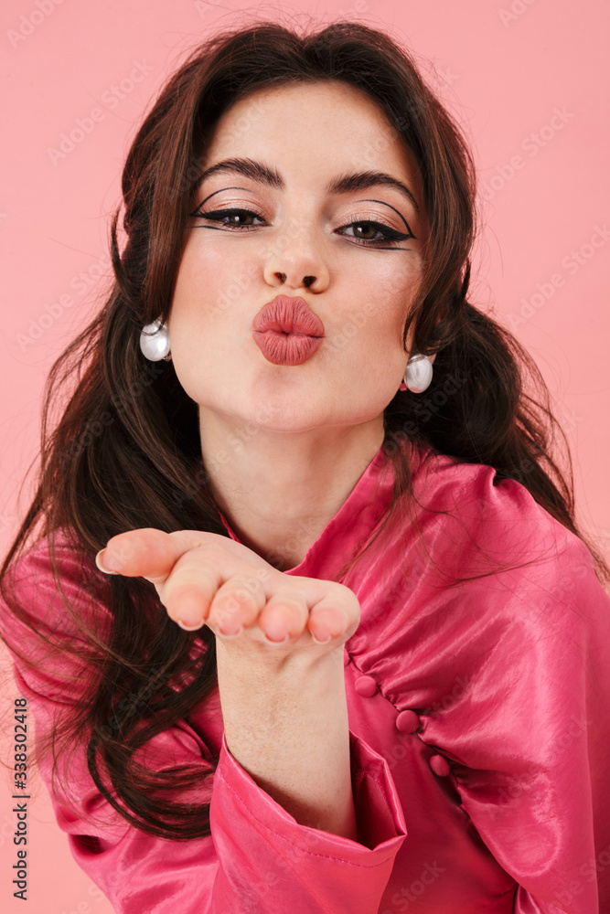 Sticker girl in pink dress posing isolated over pink wall