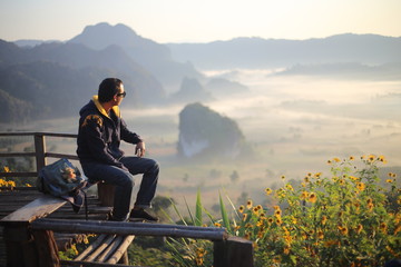 Men enjoy the view of Phu Lanka in the morning in Phayao, Thailand.