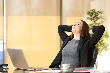 Relaxed executive breathing fresh air at the office