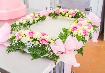 the real pastry, pastries prepared in the artisan laboratory, cake for ceremony under construction, sponge cake, cream, cream and decorations with flowers