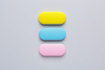 Bright erasers on grey background