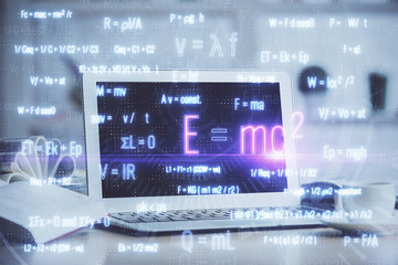 Desktop computer background and formula hologram writing. Double exposure. Education concept.