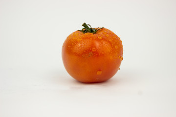 orange tomato in white background
