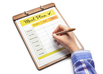 Woman making meal plan on white background