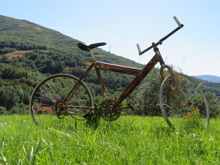 Fototapeta na wymiar Beautiful photo of a rusty old bicycle and abused