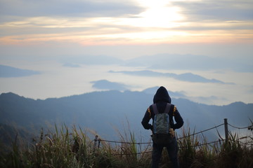 A man standing in the view at Phu Chi Fa National Park, Chiang Rai, Thailand
