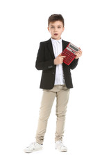 Surprised little boy with calculator on white background