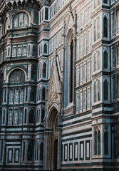 Santa Maria del Fiore Cathedral, beautiful detailed view, Florence, Tuscany, Italy. Piece of art, and part of Unesco. Structure and marble walls. Vertical amazing shot. 