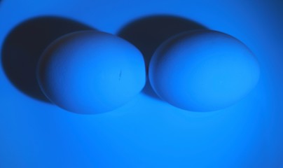 Easter. white eggs in the light of a blue lantern