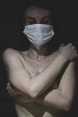 naked woman wearing a mask at the time of the coronavirus epidemic