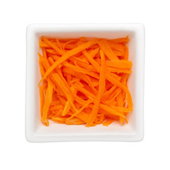 Shredded carrot in a square bowl isolated on white background; 
