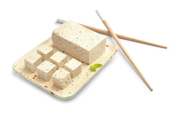 Plate with tasty tofu cheese on white background