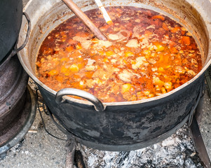 Romanian traditional food prepared at the cauldron on the open fire