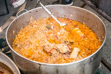 Romanian traditional food prepared at the cauldron on the open fire