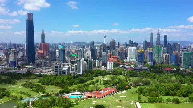 KUALA LUMPUR, MALAYSIA - FEBRUARY 28, 2020: 4K clip aerial view of Kuala Lumpur city center skyline cityscapes with blue sky. High rise buildings.