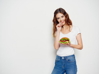 young woman holding a bowl of fruit