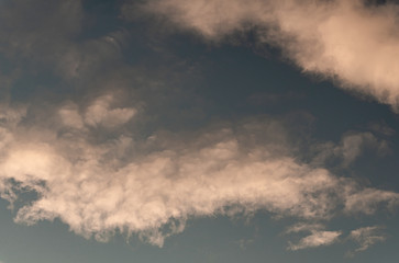 White clouds in the sunset sky