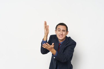 young businessman showing victory sign