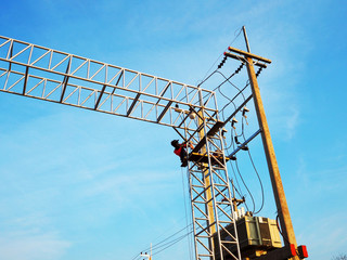 Man Working on the Working at height on construction site with blue sky