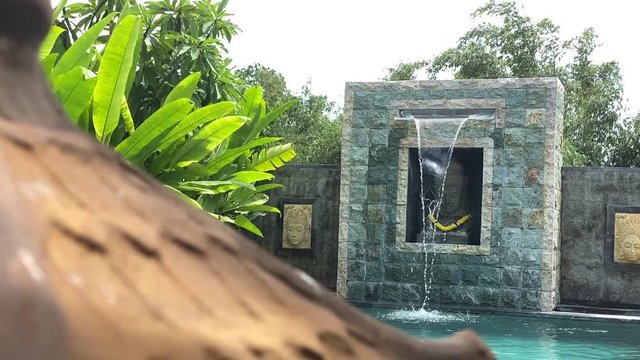 fountain Bali style architecture , garland offering to Dewa Brahma.