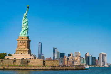 The statue of Liberty  with blue sky background. © checubus