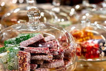 Turkish delight under a glass bell on a display case