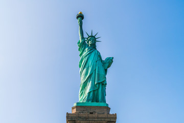 Fototapeta premium The statue of Liberty with blue sky background.
