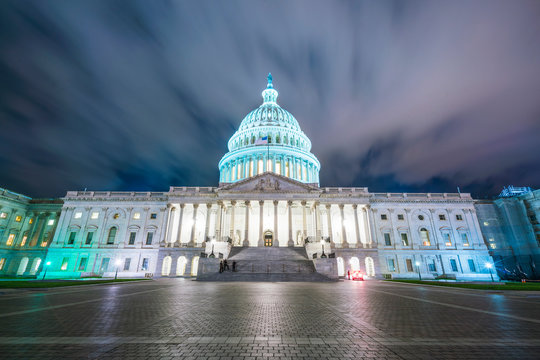 The United States Capitol Building At Night.