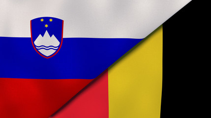 The flags of Slovenia and Belgium. News, reportage, business background. 3d illustration