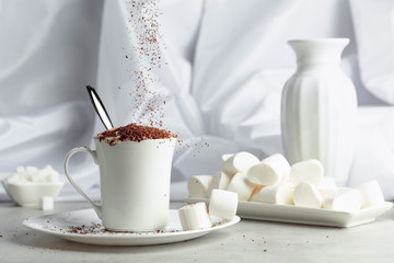 Hot chocolate with marshmallows sprinkled with chocolate crumbs.