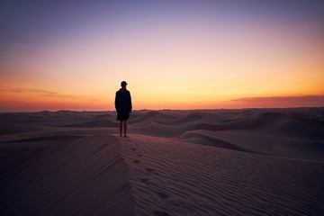 Fototapeta na wymiar Lonely man in the middle of desert