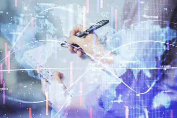 International business hologram over hands taking notes background. Concept of success. Multi...