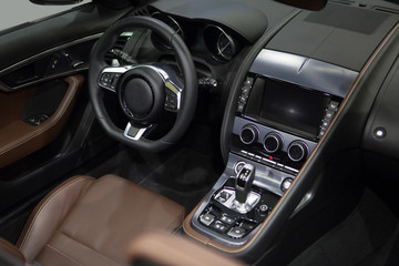 Obraz na płótnie Canvas Luxury car interior. Driver's seat, steering wheel, gear lever, dashboard