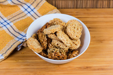 Round sesame and sunflower seed candies in the white bowl