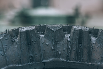 Old car wheel. Vintage car tires for offroad. Wheel of an old truck close-up.