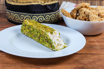 Nougat bar on dish against the other oriental sweets closeup