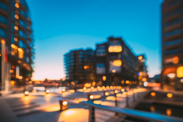 Oslo, Norway. Night Abstract Boke Bokeh Background Effect. Residential Multi-storey Houses In Aker Brygge District. Summer Evening. Famous Modern Residential Area - obrazy, fototapety, plakaty