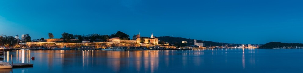 Oslo, Norway. Akershus Fortress In Summer Evening. Night View Of Famous And Popular Place. Panorama, Panoramic view