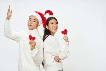 happy couple in christmas hats