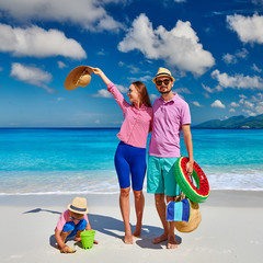Family with three year old boy on beach. Seychelles, Mahe.