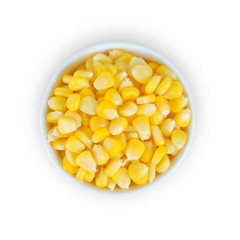 Corn in white bowl isolated on white background. Top view.