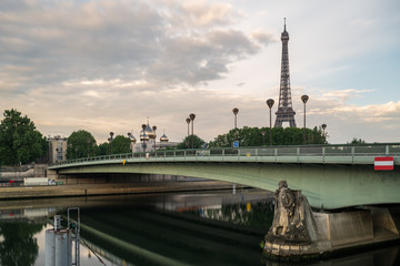Fototapeta na wymiar View of the Eiffel Tower and bridge Pont de l' Alma in Paris - France